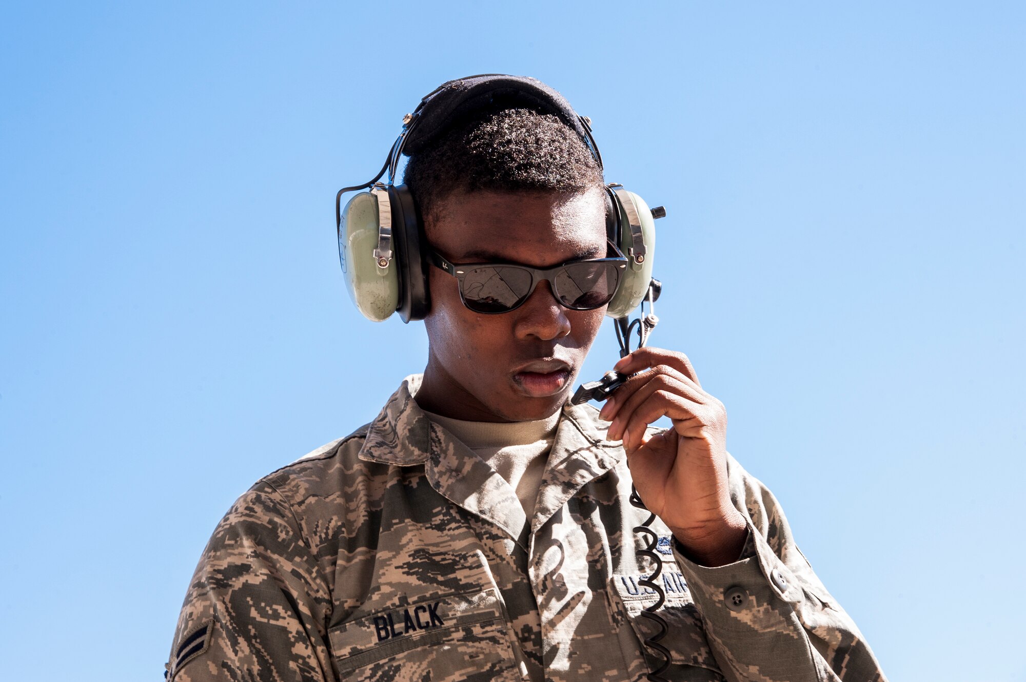 U.S. Air Force Airman 1st Class Deandre Black, 23d Aircraft Maintenance Squadron crew chief, communicates preflight inspection checklist items in preparation for flight, Feb. 18, 2016, at Moody Air Force Base, Ga. Multiple U.S. Air Force aircraft within Air Combat Command conducted joint aerial training at Grand Bay Bombing and Gunnery Range. During the training, the aircraft conducted tactical air and ground maneuvers, as well as weapons training. (U.S. Air Force photo by Andrea Jenkins/Released)