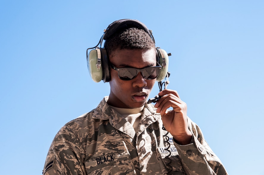 U.S. Air Force Airman 1st Class Deandre Black, 23d Aircraft Maintenance Squadron crew chief, communicates preflight inspection checklist items in preparation for flight, Feb. 18, 2016, at Moody Air Force Base, Ga. Multiple U.S. Air Force aircraft within Air Combat Command conducted joint aerial training at Grand Bay Bombing and Gunnery Range. During the training, the aircraft conducted tactical air and ground maneuvers, as well as weapons training. (U.S. Air Force photo by Andrea Jenkins/Released)