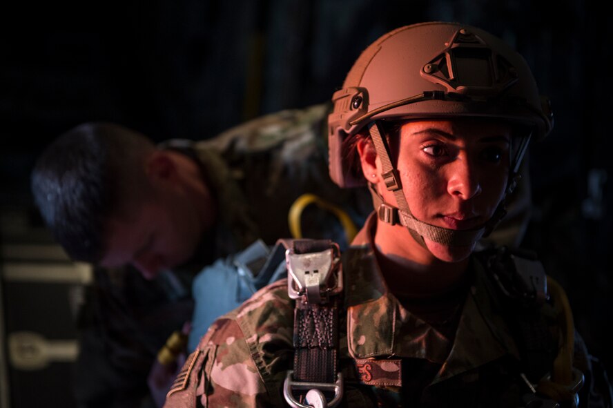 U.S. Air Force Airmen from the 820th Base Defense Group prepare for personnel drops in the back of an HC-130J Combat King II, Feb. 18, 2016, in the skies over South Ga. Multiple U.S. Air Force aircraft within Air Combat Command conducted joint aerial training at Grand Bay Bombing and Gunnery Range. During the training, the aircraft conducted tactical air and ground maneuvers, as well as weapons training. (U.S. Air Force photo by Senior Airman Ryan Callaghan/Released)
