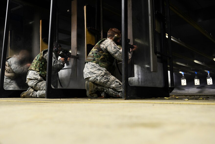 Team Shaw Airmen fire M4 carbines as part of their annual M4 recertification at the 20th Security Forces Squadron firing range at Shaw Air Force Base, S.C., Feb. 24, 2016. Airmen from varying Air Force careers recertify on the M4 carbine and M9 pistol annually at the firing range. (U.S. Air Force photo by Airman 1st Class Christopher Maldonado)