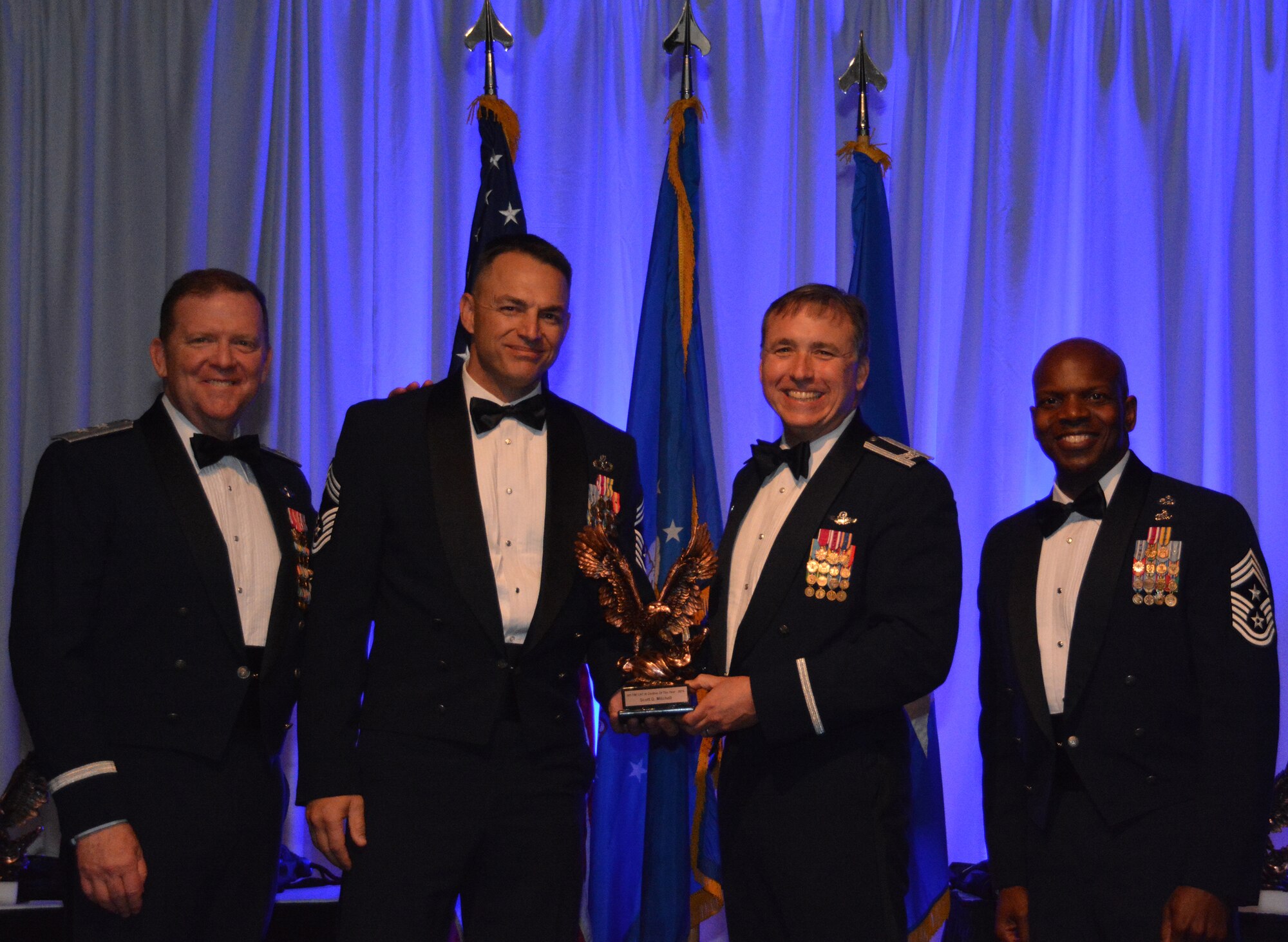 NAVAL AIR STATION FORT WORTH JOINT RESERVE BASE, Texas – Mr. Scott Mitchell, 44th Fighter Group, Tyndall Air Force Base, Fla., a geographically-separated unit, accepts the 2015 Civilian of the Year Category III award from Col. John Breazeale, 301st Fighter Wing commander, Feb. 20 at the Fort Worth Stockyards, Texas. Mitchell was among 10 nominees recognized for excellence at this year’s Annual Awards Banquet. (U.S. Air Force photo by Staff Sgt. Samantha Mathison)