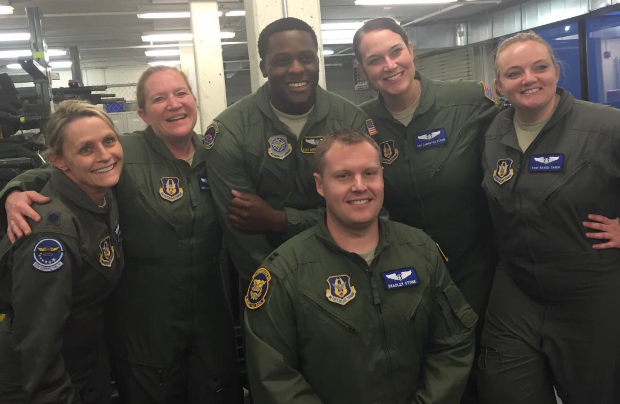 Capt. Bradley Stone, front, and Senior Airman Samantha Strom, back row, fourth from left, both assigned to the 932nd Aeromedical Evacuation Squadron (Reserve), assisted in the rescue of helicopter crash victims while touring Pearl Harbor, Hawaii, Feb. 18. (Courtesy photo)