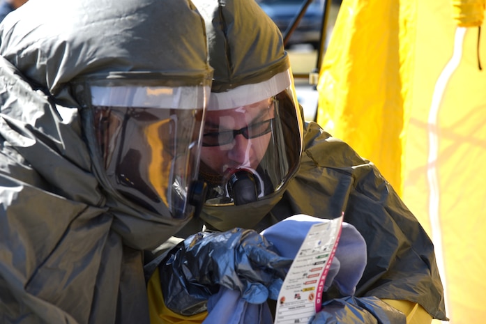 Petty Officer 1st Class Terro Walker, left, and Seaman Apprentice
Christopher Bishop, both hospital corpsmen at Naval Health Clinic
Charleston, read a Chemical, Biological, Radiological, Nuclear and
Explosives Equipment Selection Matrix for emergency responders during a
timed CBRNE exercise Feb. 18. NHCC's medical first responders practiced
life-saving skills required to triage, initiate field treatment,
decontaminate and save victims during a CBRNE event. (Navy photo by Petty
Officer 3rd Class Robert Jackson)
