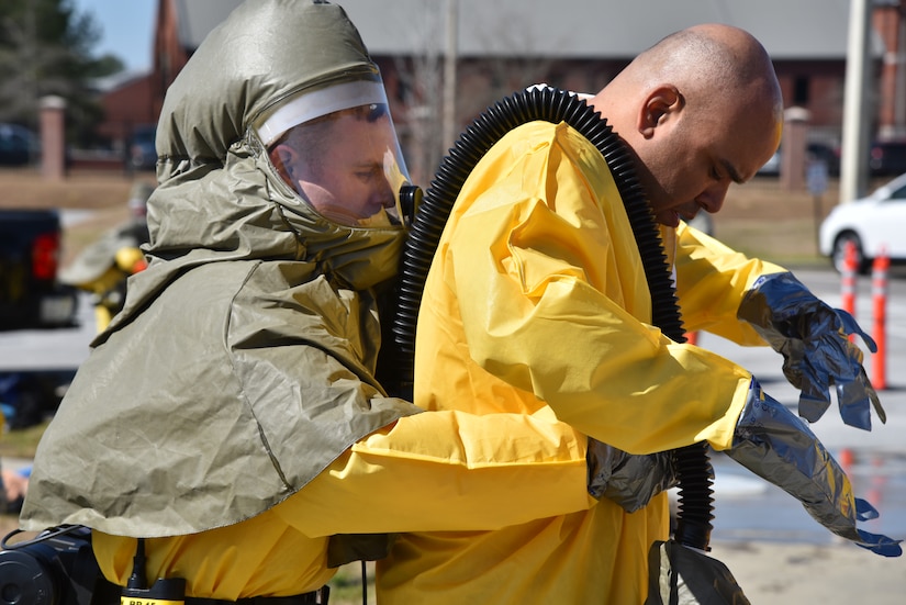 Navy Lt. j.g. Aaron Mehlberg, radiology department head and radiation health
officer of Naval Health Clinic Charleston, left, helps Petty Officer 1st
Class Tyrel Maynor, a NHCC information systems technician, attach the belt
for his Powered Air Purifying Respirator during a timed Chemical,
Biological, Radiological, Nuclear and Explosives exercise Feb. 18. NHCC's
medical first responders practiced life-saving skills required to triage,
initiate field treatment, decontaminate and save victims during a CBRNE
event. (Navy photo by Petty Officer 3rd Class Robert Jackson)
