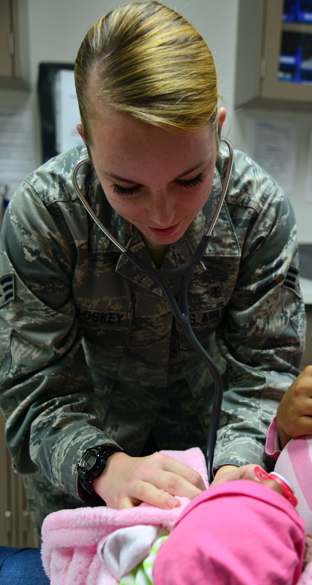 U.S. Air Force Senior Airman Sierra McCroskey, aerospace medicine technician assigned to the 633rd Medical Operations Squadron, listens to a patient’s heart during a weight-check appointment at Langley Air Force Base, Va., Feb. 24, 2016. The pediatric clinic staff treats USAF Hospital Langley out- and inpatients from birth to 18 years old. (U.S. Air Force photo by Staff Sgt. Aubrey White)