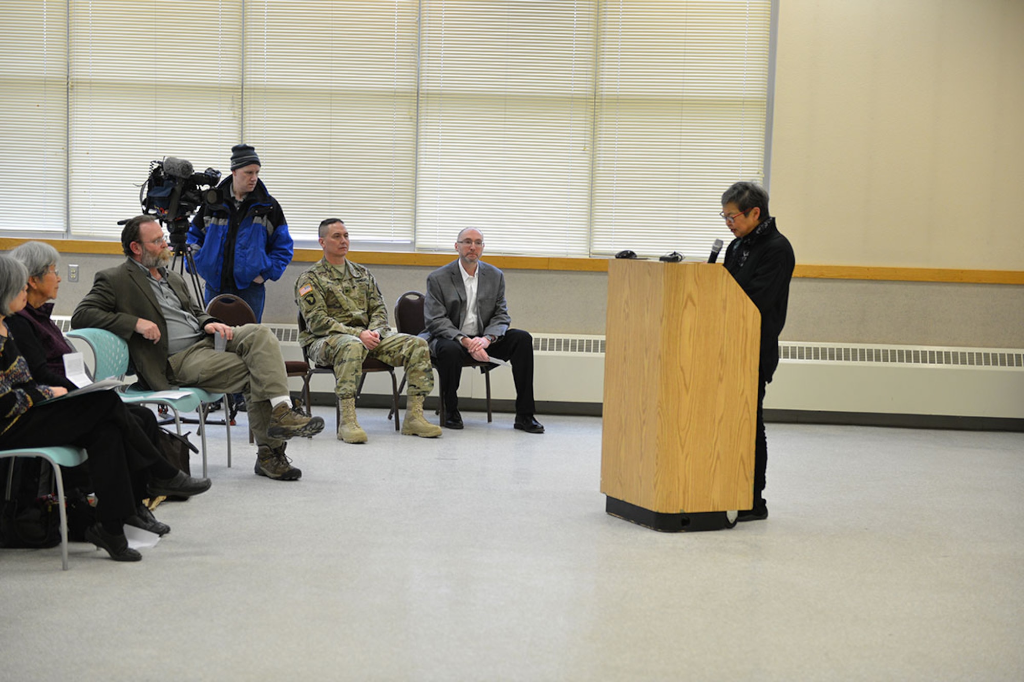 Mary Abo, daughter of John Tanaka, who was arrested and interned out of Juneau, Alaska, shares her childhood memories at Joint Base Elmendorf-Richardson's Day of Remembrance ceremony, Feb. 19 at the Army Reserve Center. The ceremony highlighted findings on JBER-Richardson's internment camp and was held in honor of the men, women, and children of Japanese descent who were interned by the U.S. during World War II. (U.S. Air Force photo by Airman 1st Class Kyle Johnson)