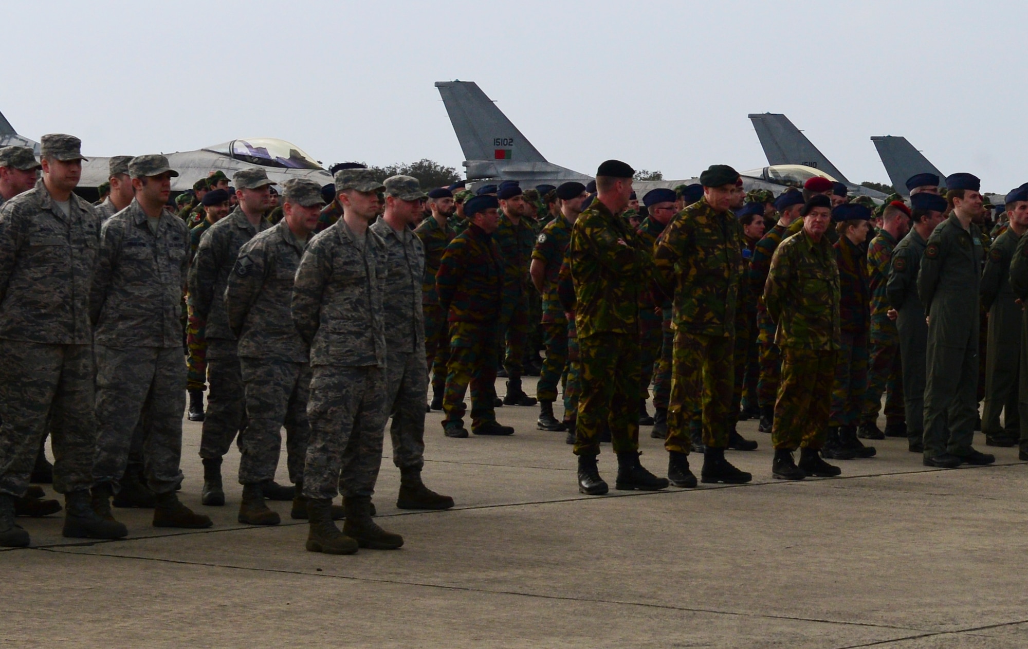 Airmen from the 48th Fighter Wing stand in formation along with Portuguese, Belgian, Danish French, Dutch, Norwegian, Spanish and other NATO ally forces during the opening ceremony for Real Thaw 2016 at Beja Air Base, Portugal, Feb. 21, 2016. Participating in exercises like RT16 are an important component to remaining “Forward, Ready, Now,” for the 48th FW. RT16, taking place from February 22-March 3, is an exercise planned and conducted by the Portuguese air force, under the aegis of its Air Command, who are responsible for training and readying the operational units, through air operations in the defense of national interests, as well as through the participation in military operations in several international cooperation frameworks.  (U.S. Air Force photo by Senior Airman Dawn M. Weber/Released)