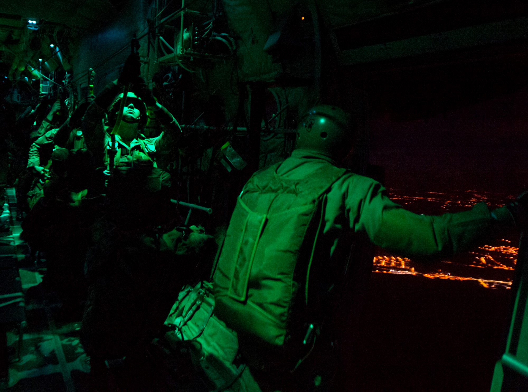 Portuguese paratroopers jump out of a C-130J Super Hercules assigned to the 37th Airlift Squadron as part of exercise Real Thaw 16 Feb. 22, 2016, in Beja, Portugal. The 37th AS Airmen supported approximately 70 paratroopers during the event. Real Thaw 16 is a Portuguese hosted NATO exercise that provides tactical training to multiple participating nations to include the U.S., Portugal, Belgium, Denmark, France, Netherlands, Norway and Spain. (U.S. Air Force photo/Senior Airman Jonathan Stefanko)