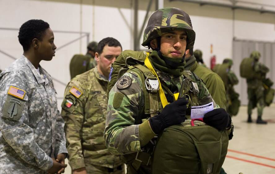 U.S. Army jumpmasters inspect a Portuguese paratrooper before loading onto a C-130J Super Hercules assigned to the 37th Airlift Squadron during exercise Real Thaw 16 Feb. 22, 2016, in Beja, Portugal. Real Thaw 16 is a Portuguese hosted, NATO exercise that provides tactical training to multiple participating nations including the U.S., Portugal, Belgium, Denmark, France, Netherlands, Norway and Spain. (U.S. Air Force photo/Senior Airman Jonathan Stefanko)