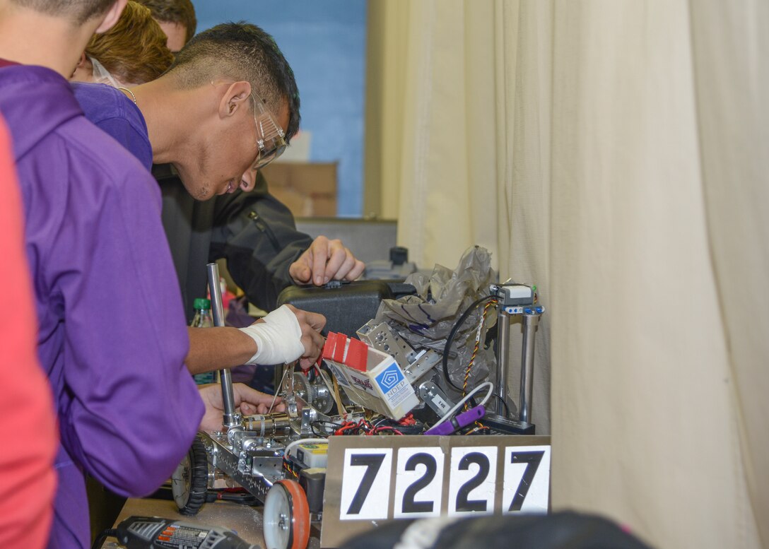 Joseph Santiago, grade 12, is in his second year on team #7227 Scorpion Robotics. Feb. 23 he worked with his team on the robot, which will participate in the L.A. Regional Championship Tournament Feb. 27 in Monrovia, California. (U.S. Air Force photo by Rebecca Amber)