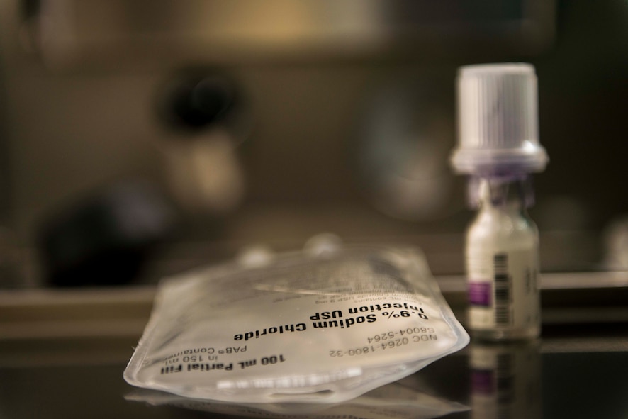 U.S. Air Force Staff Sgt. Marcus Hollins, a pharmacy technician with the 35th Medical Support Squadron, placed this saline pouch and medication on a counter before injecting the drug into the pouch for a procedure later that day at Misawa Air Base, Japan, Feb. 4, 2016. The medication, and in this case, an antibiotic, is injected directly into the saline solution pouch to dilute the medication to ensure the patient receives the correct dosage. Hollins is a McDonough, Georgia, native. (U.S. Air Force photo by Staff Sgt. Benjamin W. Stratton)