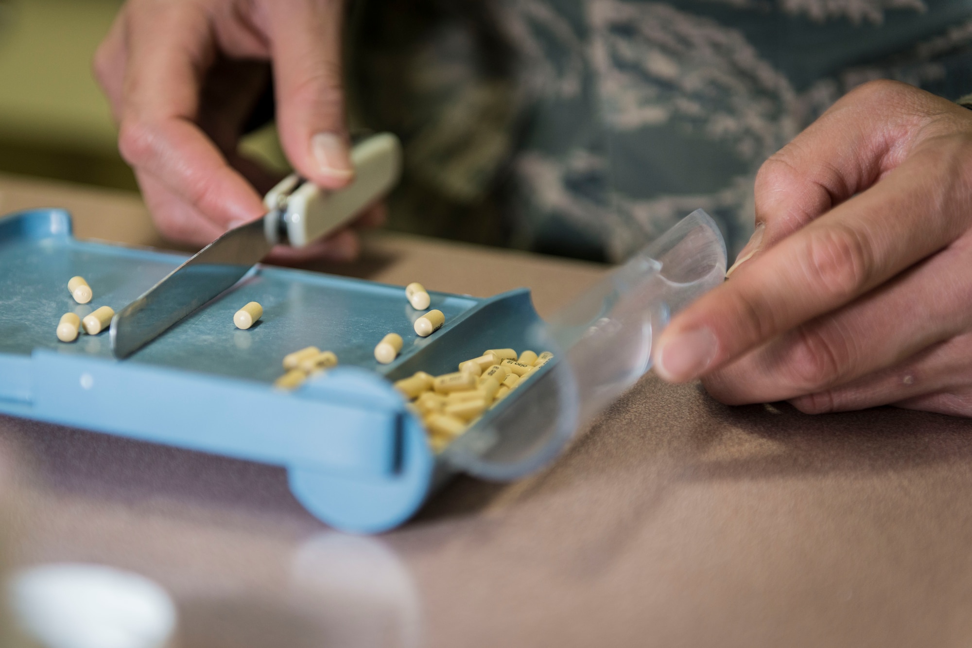 U.S. Air Force Maj. Francisco Boral, a pharmacist with the 35th Medical Support Squadron, verifies the count of a controlled medication at Misawa Air Base, Japan, Feb. 4, 2016. As part of their mandatory double-checks process, Air Force pharmacists must recount prescriptions before issuing them to patients. Boral said that sometimes the count they receive from manufacturers is not what is listed on the label. This process ensures the safety of both patients and their medical providers. Boral is an Oxnard, California, native. (U.S. Air Force photo by Staff Sgt. Benjamin W. Stratton)
