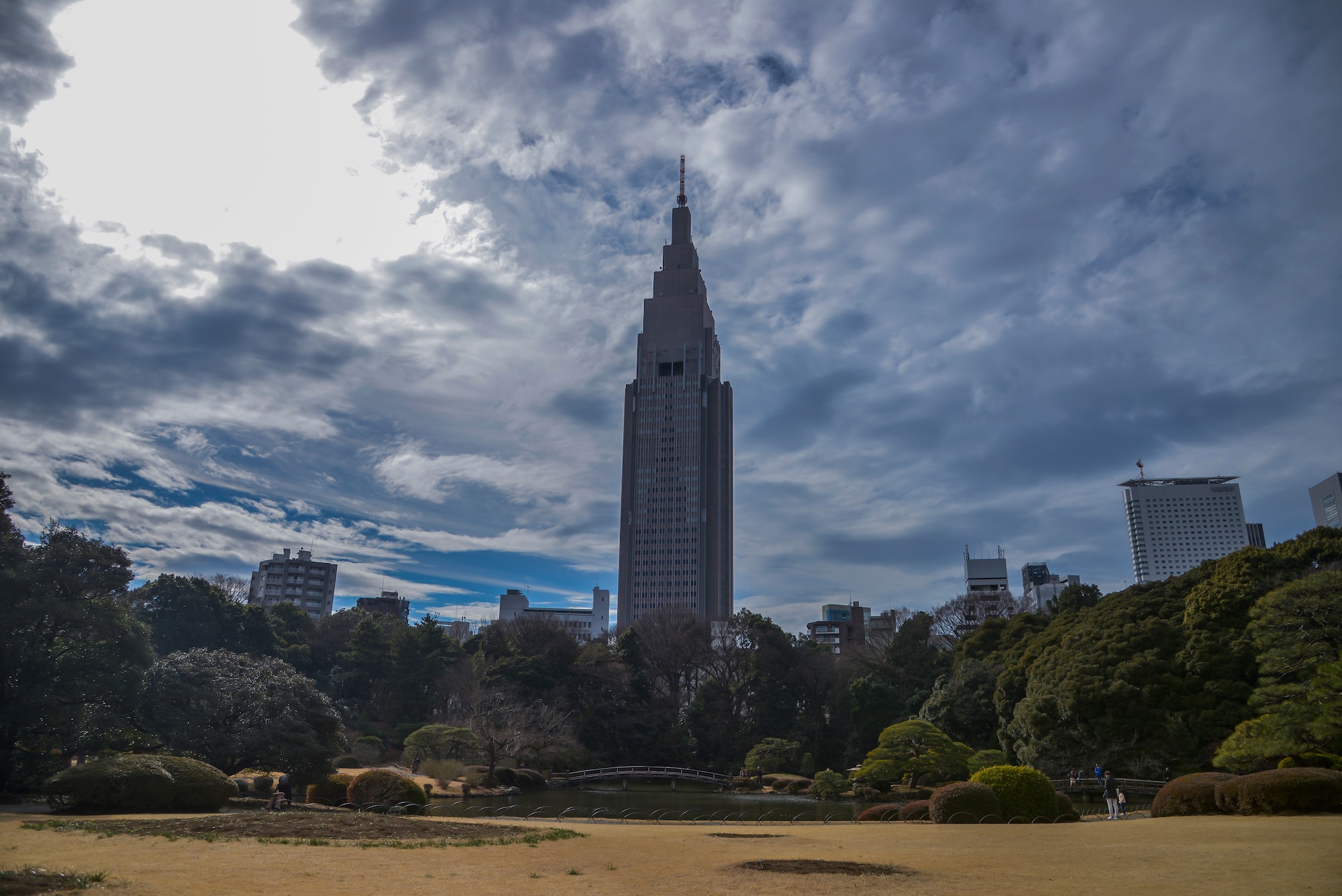 Clouds move over a tree line within the Shinjuku Gyoen National Garden, Shinjuku, Japan, Feb. 17, 2016. The park is a short walk from Shinjuku Station and has three gates to enter the park: Shinjuku gate, Okido gate and Sendagaya gate. (U.S. Air Force photo by Senior Airman David Owsianka/Released)