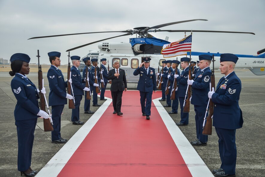 Lt. Gen. John Dolan, U.S. Forces, Japan and 5th Air Force commander, and Gen Nakatani, Minister of Defense for Japan, walk down the red carpet on the flightline at Yokota Air Base, Japan, Feb. 23, 2016. During his visit, Nakatani received a USFJ orientation, toured the Air Defense Command building and met with US military and Japanese leaders. (U.S. Air Force photo by Senior Airman David Owsianka/Released)
