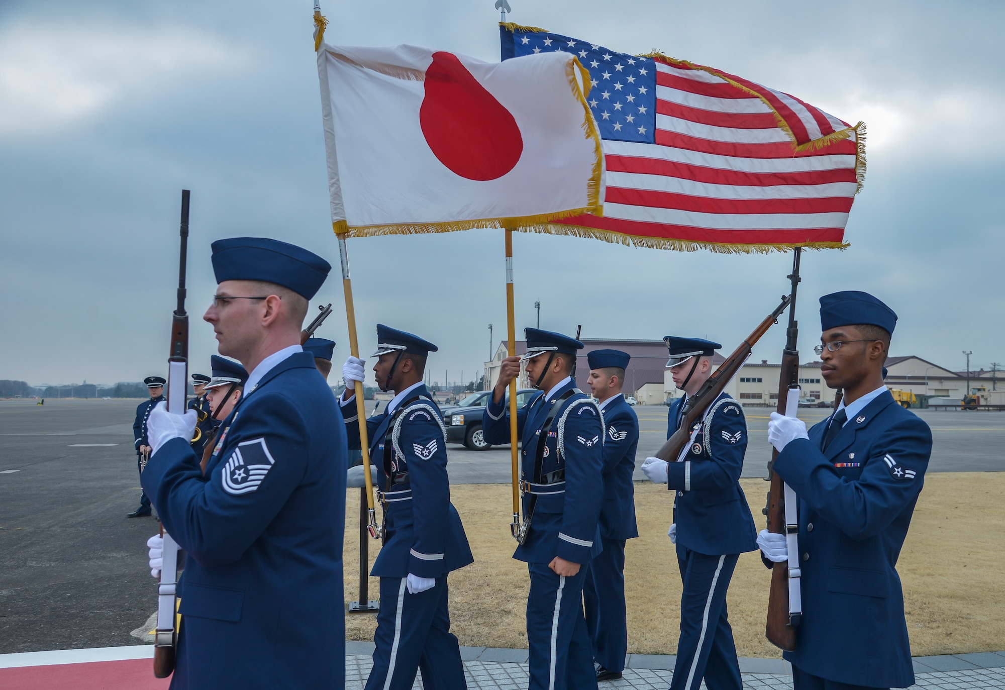 Members of the 374th Airlift Wing base honor guard standby to welcome Gen Nakatani, Minister of Defense for Japan, during his visit at Yokota Air Base, Japan, Feb. 23, 2016. Nakatani received briefings about the U.S. Forces, Japan mission and defense of Japan during his visit to the base. (U.S. Air Force photo by Senior Airman David Owsianka/Released)