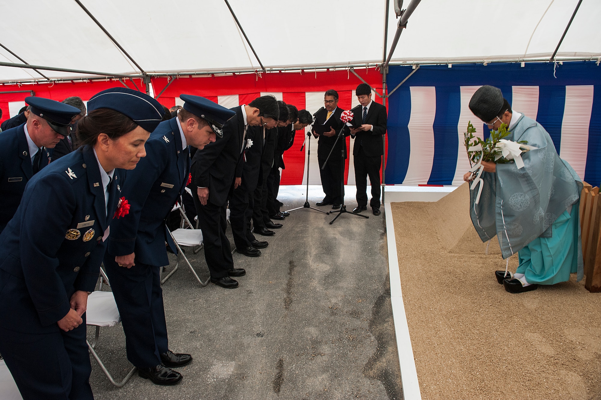 A Shinto priest gives a traditional ceremonial blessing during a ground breaking ceremony Feb. 24, 2016, at Kadena Air Base, Japan. The ceremony was held to officially start the construction on the new Rocker NCO Club. The ceremony is customary for Japanese construction and the user of the facility is invited to take part. Leadership from Kadena’s 18th Wing participated in the ceremony, laying down flowers and officially breaking the ground for the new NCO Club. (U.S. Air Force photo by Airman 1st Class Corey M. Pettis)  