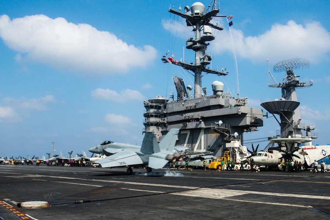 An F/A-18E Super Hornet assigned to the Warhawks of Strike Fighter Squadron 97 lands on the flight deck of the aircraft carrier USS John C. Stennis in the Philippine Sea, Feb. 21, 2016. The Stennis provides a ready force to support security and stability in the Indo-Asia-Pacific region. U.S. Navy photo by Seaman Tomas Compian