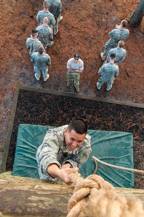 A soldier climbs a rope during the obstacle portion of the Army Air Assault Course held at Camp Blanding Joint Training Center, Starke, Fla., Feb. 23, 2016. Florida Army National Guard photo by Sgt. Christopher Milbrodt