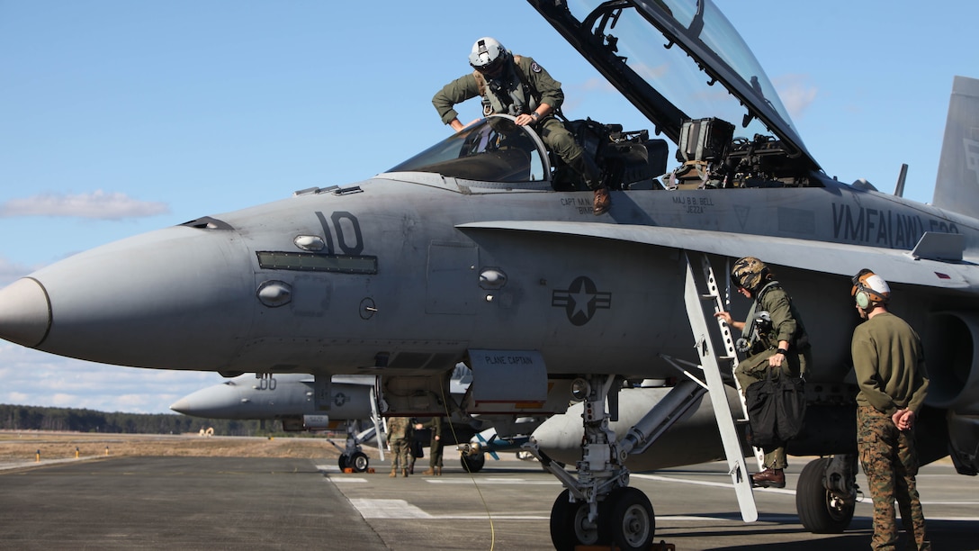 Pilots exit an F/A-18 Hornet to swap with a different crew during a hot loading procedure during Exercise Coastal Predator at Marine Corps Air Station Cherry Point, N.C., Feb. 16, 2016. Hot loading, aka hot rearming, is a reloading procedure completed while the aircraft’s engine is still running, drastically reducing the time to get back in the fight. Coastal Predator is an exercise that included Marine Corps and Army aviation assets along with Air Force personnel and civilian contractors to conduct Forward Air Controller Airborne training in accordance with the pre-deployment training program. 