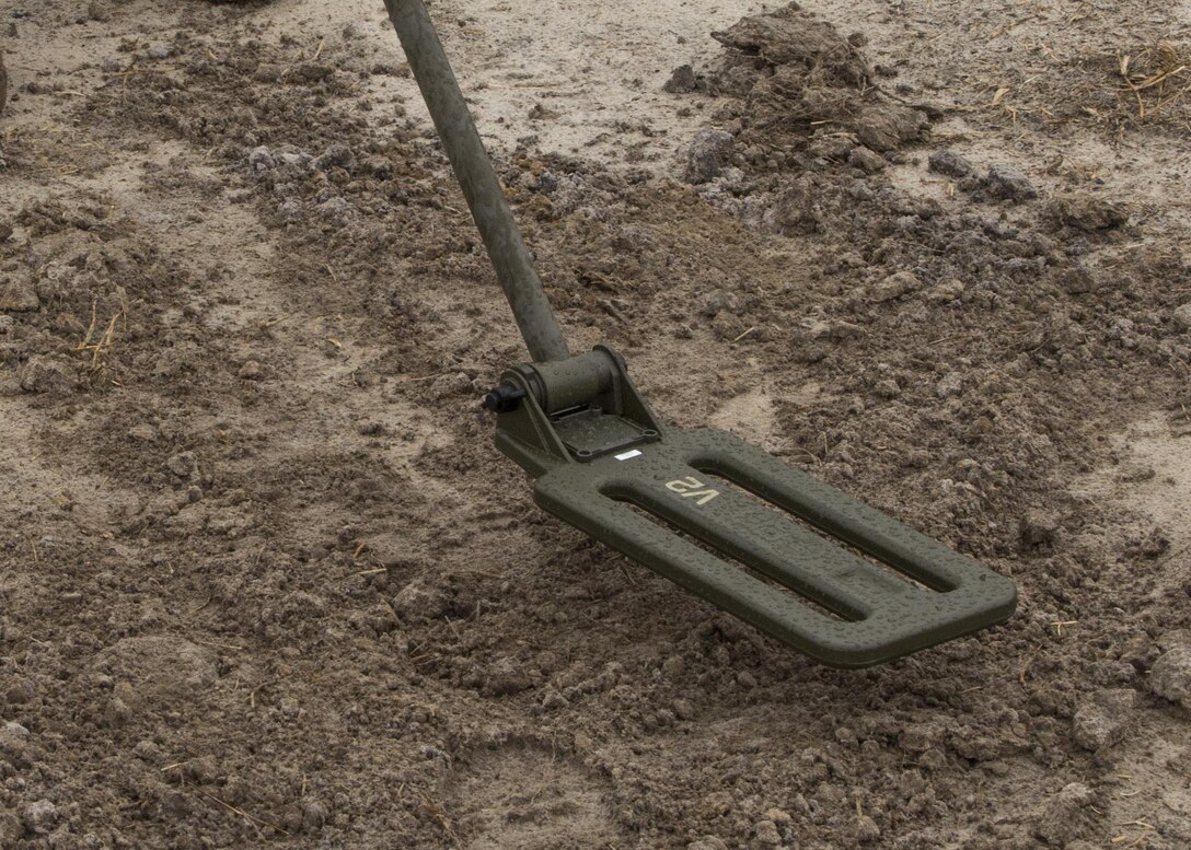 A metal detector, used by a Marine with Combat Logistics Battalion 2, sweeps the ground during an improvised explosive device training exercise taught by Explosive Ordnance Disposal Marines at Camp Lejeune, N.C., Feb. 23, 2016. The Marines learned how to recognize signs of an IED during hands-on training in preparation for their upcoming deployment with Special Purpose Marine Air Ground Task Force Crisis Response Africa. (U.S. Marine Corps photo by Lance Cpl. Aaron K. Fiala/Released)