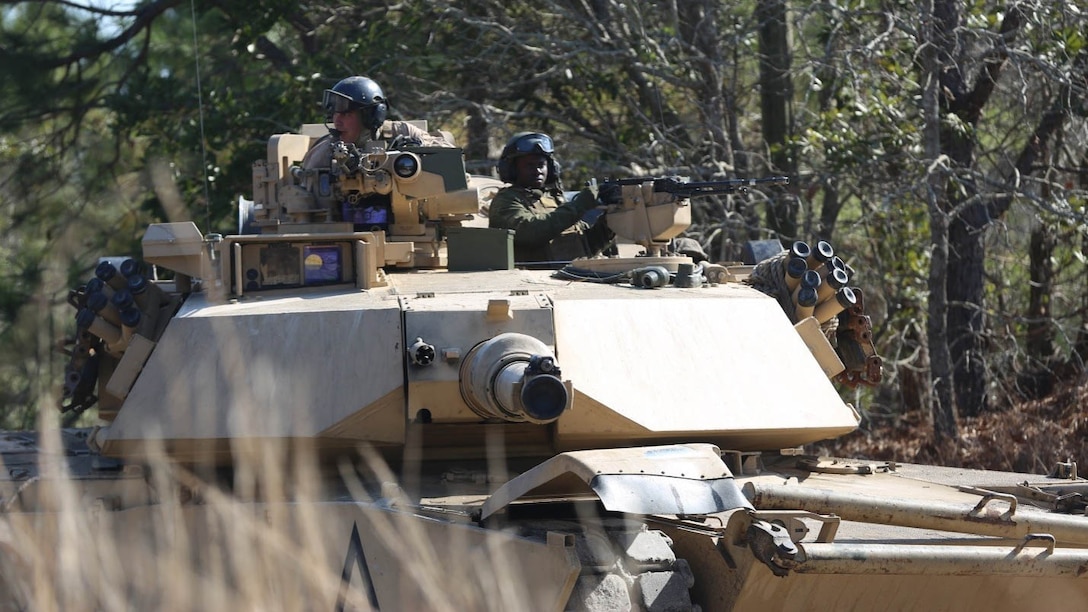 Marines with 2nd Tank Battalion along with 3rd Battalion, 6th Marine Regiment conducted a raid on Combat Town at Marine Corps Base Camp Lejeune, N.C., Feb. 21, 2016. 2nd Tanks provided direct fire support while the Marines from 3/6 assaulted the town after receiving word that the town held opposition forces within. The raid was part of a weeklong, large-scale operation known as Iron Blitz. Iron Blitz, a Marine Corps Combat Readiness Evaluation, tested 2nd Tanks in their ability to integrate all aspects of the Marine Air-Ground Task Force and function as a deployment-ready unit.