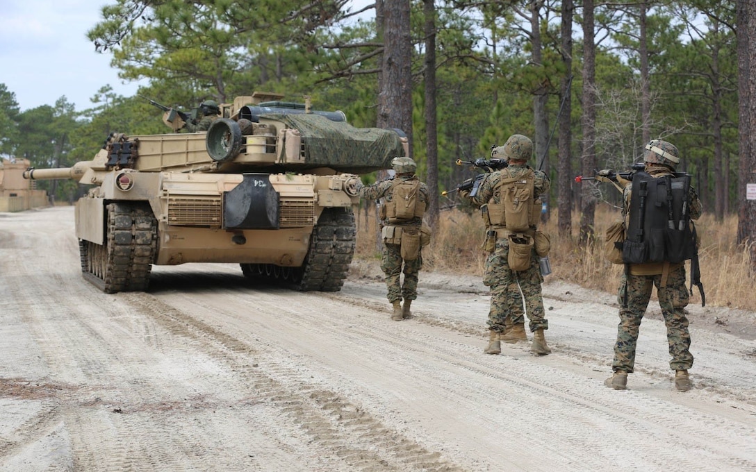 Marines with 2nd Tank Battalion along with 3rd Battalion, 6th Marine Regiment conducted a raid on Combat Town at Marine Corps Base Camp Lejeune, N.C., Feb. 21, 2016. 2nd Tanks provided direct fire support while the Marines from 3/6 assaulted the town after receiving word that the town held opposition forces within. The raid was part of a weeklong, large-scale operation known as Iron Blitz. Iron Blitz, a Marine Corps Combat Readiness Evaluation, tested 2nd Tanks in their ability to integrate all aspects of the Marine Air-Ground Task Force and function as a deployment-ready unit. 