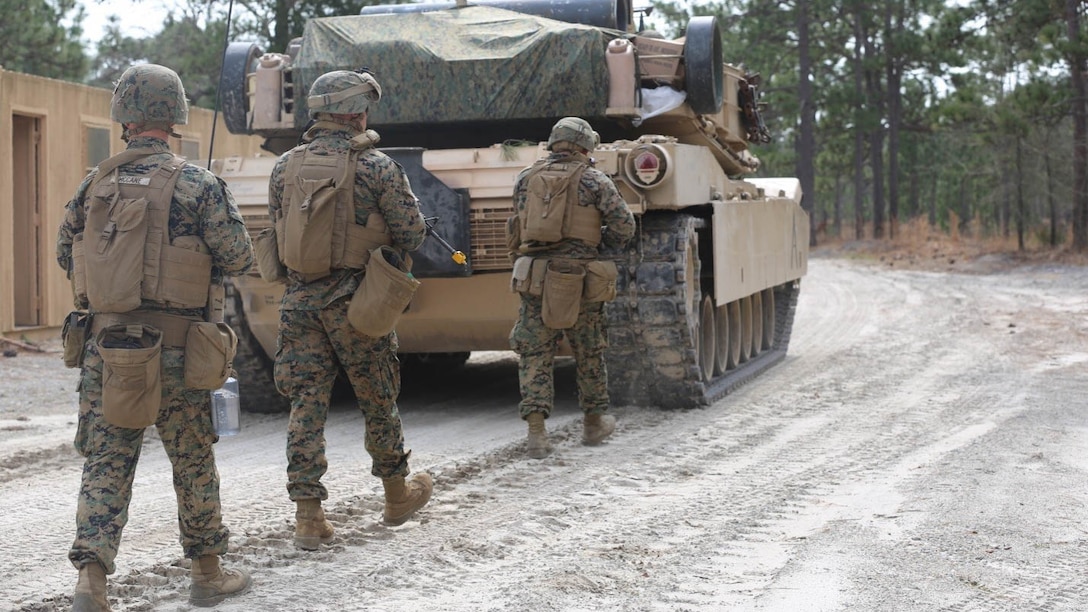 Marines with 2nd Tank Battalion along with 3rd Battalion, 6th Marine Regiment conducted a raid on Combat Town at Marine Corps Base Camp Lejeune, N.C., Feb. 21, 2016. 2nd Tanks provided direct fire support while the Marines from 3/6 assaulted the town after receiving word that the town held opposition forces within. The raid was part of a weeklong, large-scale operation known as Iron Blitz. Iron Blitz, a Marine Corps Combat Readiness Evaluation, tested 2nd Tanks in their ability to integrate all aspects of the Marine Air-Ground Task Force and function as a deployment-ready unit. 