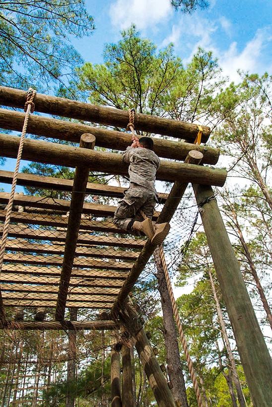 Soldiers and airmen climb a rope during the obstacle portion of the Army Air Assault Course held at Camp Blanding Joint Training Center, Starke, Fla., Feb. 23, 2016. Florida Army National Guard photo by Sgt. Christopher Milbrodt