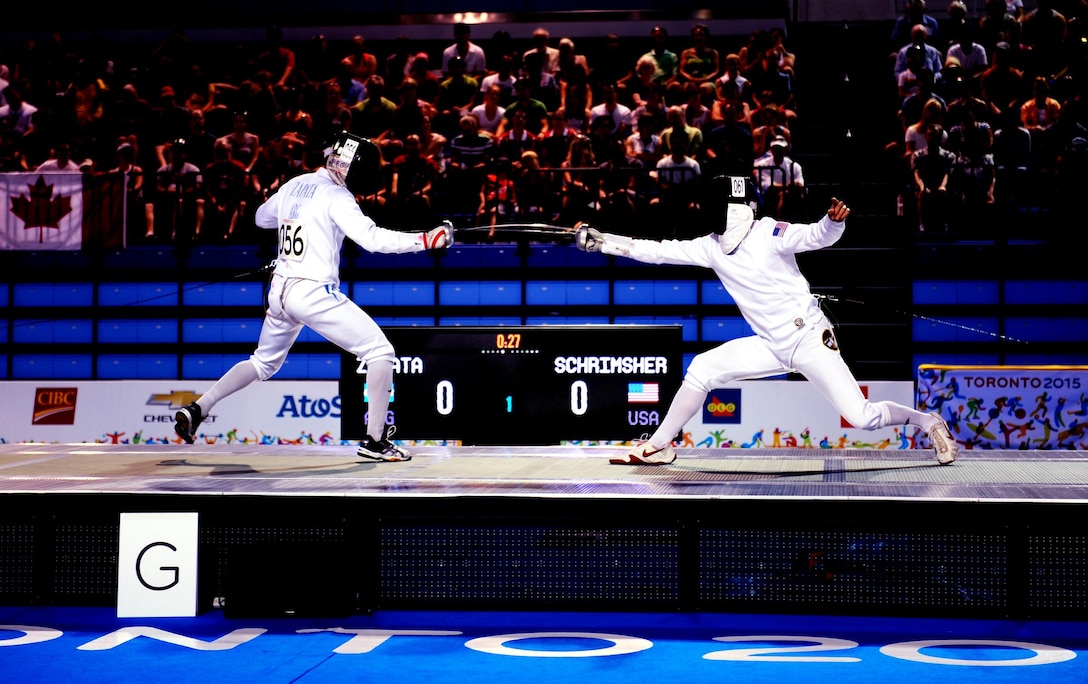 Spc. Nathan Schrimsher of the U.S. Army World Class Athlete Program defeats Emmanual Zapata of Argentina in a fencing bonus round bout en route to earning a berth in the 2016 Olympic Games with a third-place finish in men's Modern Pentathlon at the 2015 Pan American Games in Toronto on July 19. U.S. Army photo by Tim Hipps, IMCOM Public Affairs #WCAP #RoadToRio #TeamUSA #2015PanAmerican Games