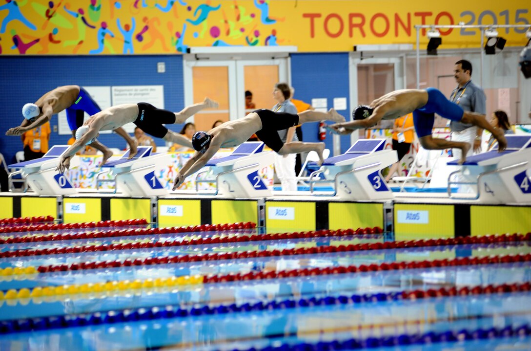 Olympian and Army Sgt. Dennis Bowsher (third from left) starts the 200-meter freestyle swim portion of the men's Modern Pentathlon event July 19 at the 2015 Pan American Games in Toronto. Bowsher finished seventh in swimming with a time of 2 minutes, 6.10 seconds and 10th in Modern Pentathlon with 1,348 points. U.S. Army photo by Tim Hipps, IMCOM Public Affairs