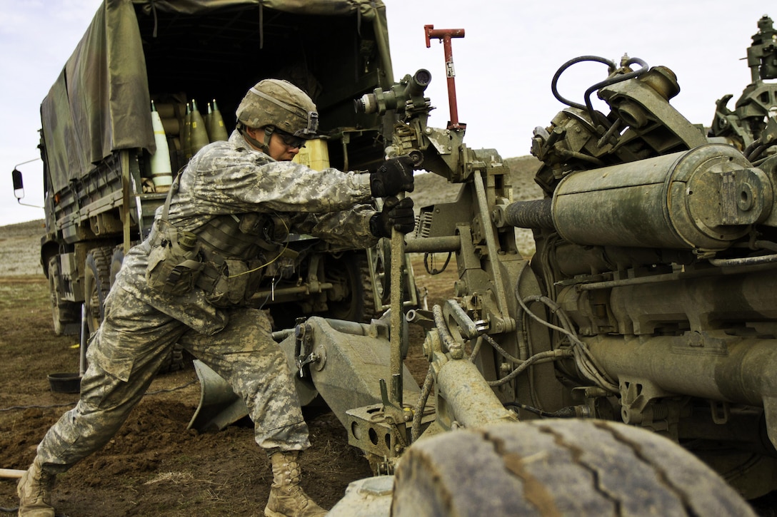 Army Pvt. Emanuel Zavala helps set up an M777 howitzer at the Yakima Training Center, Yakima, Wash., Feb. 24, 2016. Cannon crew members set up the M777 in five to seven minutes. Zavala is a cannon crew member assigned to the 1st Battalion, 37th Field Artillery Regiment, 2nd Division Artillery, 7th Infantry Division, Joint Base Lewis-McChord, Wash. U.S. Army photo by Sgt. Cody Quinn