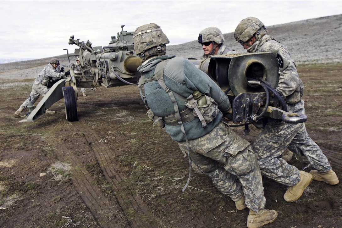 Cannon crew members set up an M777 howitzer during a combined arms training exercise at the Yakima Training Center, Yakima, Wash., Feb. 24, 2016. Battlefield commanders use the M777's 155 mm rounds to add an extra dimension to their operations. U.S. Army photo by Sgt. Cody Quinn