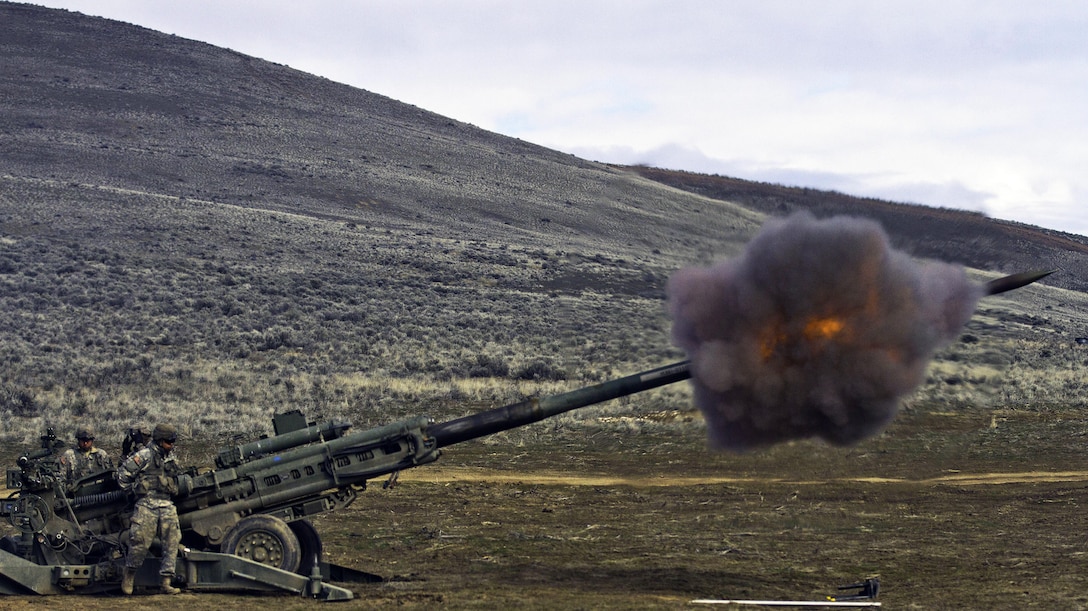 Soldiers send a round down range at the Yakima Training Center, Yakima, Wash., Feb. 24, 2016. Soldiers fired the M777 howitzer, capable of hitting a target 25 miles away. The soldiers are assigned to the 1st Battalion, 37th Field Artillery Regiment, 2nd Division Artillery, 7th Infantry Division, Joint Base Lewis-McChord, Wash. U.S. Army photo by Sgt. Cody Quinn