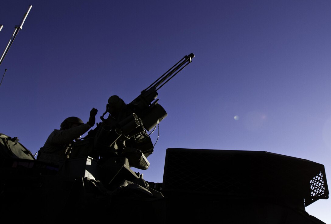 An M2 machine gun Stryker gunner loads his weapon with blank ammunition during a training exercise at theYakima Training Center, Yakima, Wash., Feb. 23, 2016. Bravo Company Stryker gunners and drivers provided mounted support for their fellow soldiers during the training. U.S. Army photo by Sgt. Cody Quinn