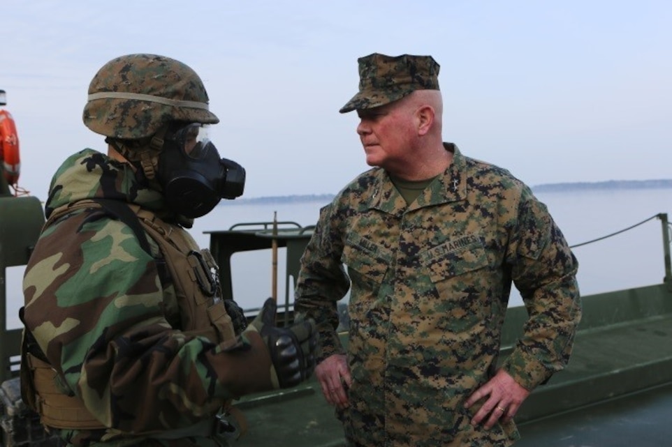 Maj. Gen. Walter L. Miller (right), commanding general of II Marine Expeditionary Force, speaks to Lt. Col. Robert Bodisch, commanding officer of 2nd Tank Battalion, 2nd Marine Division, about the progression of the Marine Corps Combat Readiness Evaluation, “Iron Blitz,” at Camp Lejeune, N.C., Feb. 22, 2016. Iron Blitz is a weeklong, large scale operation and combat-readiness evaluation used to test the battalion’s ability to integrate all aspects of the Marine Air-Ground Task Force and function as a deployment-ready unit. (Marine Corps photo by Cpl. Shannon Kroening)