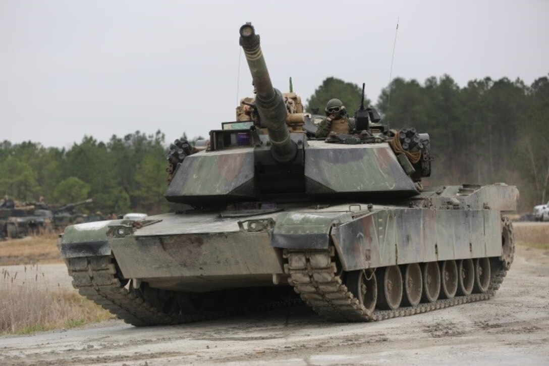 Marines with 2nd Tank Battalion, 2nd Marine Division, conducted a live-fire exercise at a tank platoon gunnery range for qualification at Camp Lejeune, N.C., Feb. 23, 2016. 2nd Tanks provided direct fire on various targets along the range while moving up and over the berms to improve their reaction times while firing with their M1A1 Abrams tanks. The gunnery range was part of a weeklong, large-scale operation known as Iron Blitz. Iron Blitz, a Marine Corps Combat Readiness Evaluation, tested 2nd Tanks in their ability to integrate all aspects of the Marine Air-Ground Task Force and function as a deployment-ready unit. (Marine Corps photo by Cpl. Shannon Kroening)