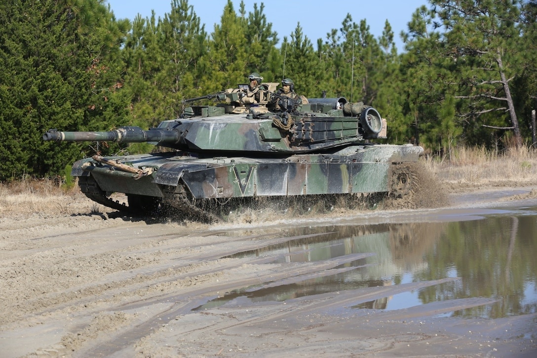 Marines with 2nd Tank Battalion along with 3rd Battalion, 6th Marine Regiment conducted a raid on Combat Town at Camp Lejeune, N.C., Feb. 21, 2016. Marines assigned to 2nd Tanks provided direct fire support while the Marines from 3/6 assaulted the town after receiving word that the town held [notional] opposition forces within. The raid was part of a weeklong, large-scale exercise known as Iron Blitz. Iron Blitz, a Marine Corps Combat Readiness Evaluation, tested 2nd Tanks in their ability to integrate all aspects of the Marine Air-Ground Task Force and function as a deployment-ready unit. (Marine Corps photo by Cpl. Shannon Kroening)