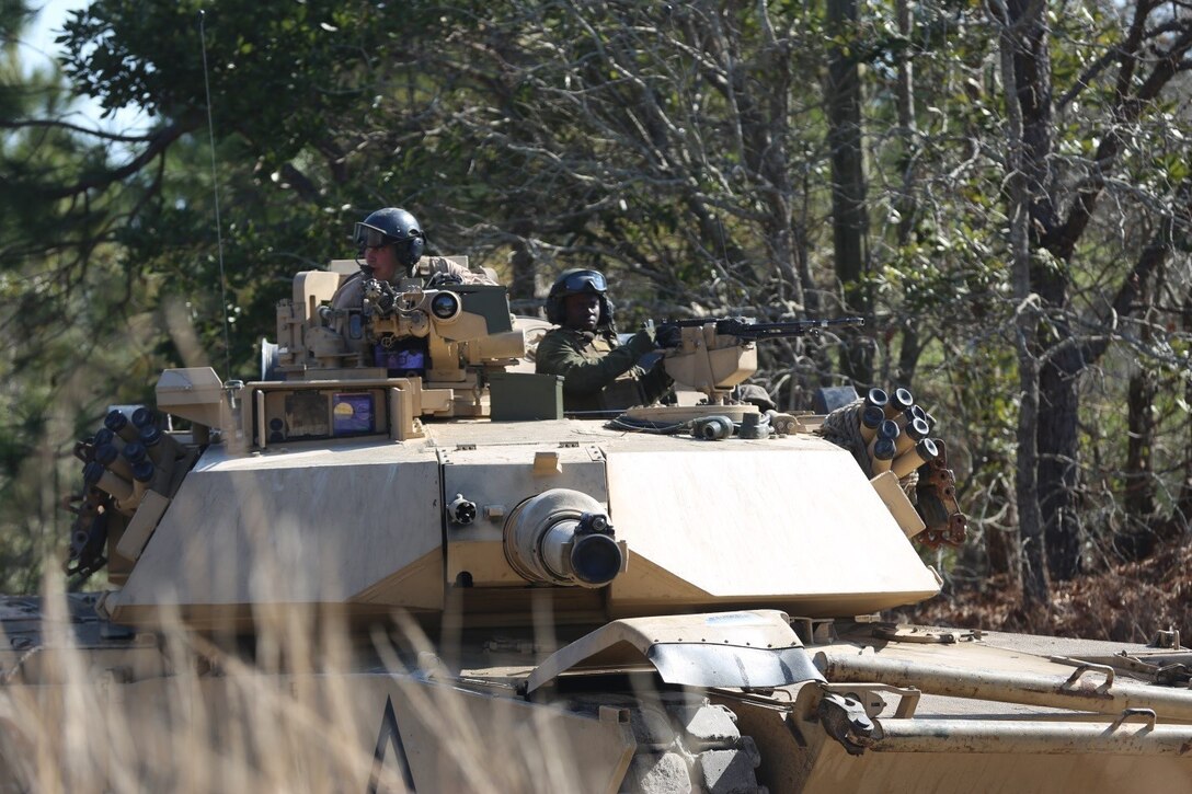 Marines with 2nd Tank Battalion along with 3rd Battalion, 6th Marine Regiment conducted a raid on Combat Town at Camp Lejeune, N.C., Feb. 21, 2016. 2nd Tanks provided direct fire support while the Marines from 3/6 assaulted the town after receiving word that the town held opposition forces within. The raid was part of a weeklong, large-scale operation known as Iron Blitz. Iron Blitz, a Marine Corps Combat Readiness Evaluation, tested 2nd Tanks in their ability to integrate all aspects of the Marine Air-Ground Task Force and function as a deployment-ready unit. (Marine Corps photo by Cpl. Shannon Kroening)