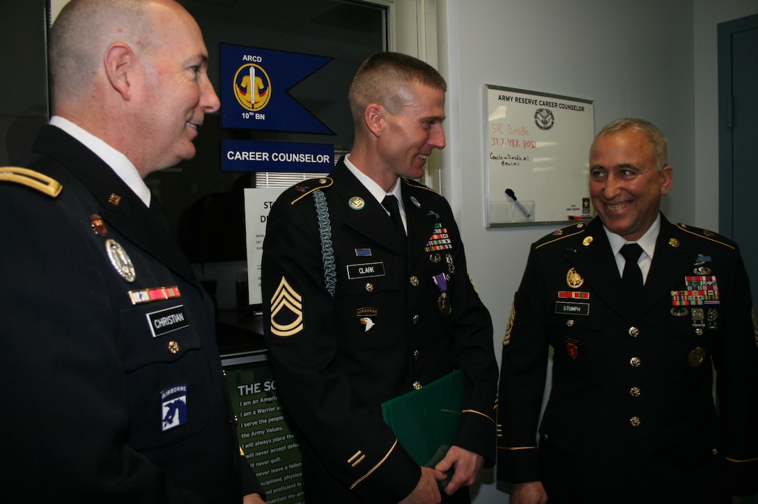 South Bend, Ind. – Command Sgt. Maj. John Stumph (left), Senior noncommissioned Officer of the 95th Training Division (IET) at Fort Sill, Okla. and Brig. Gen. Daniel Christian (right), commanding general of the 95th Training Division (IET), laugh with Sgt. 1st Class Joshua Clark following his Purple Heart pinning ceremony here Feb. 7. (photo by Capt. Adrienne Bryant)
