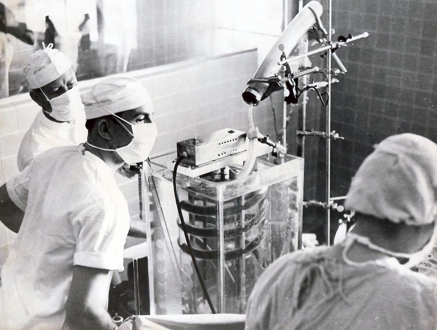 Capt. Floyd Baker (center), first-year surgical resident, using the pump-oxygenator to close an atrial septal defect during a surgery at Fitzsimons Army Hospital, Colo., in 1956.