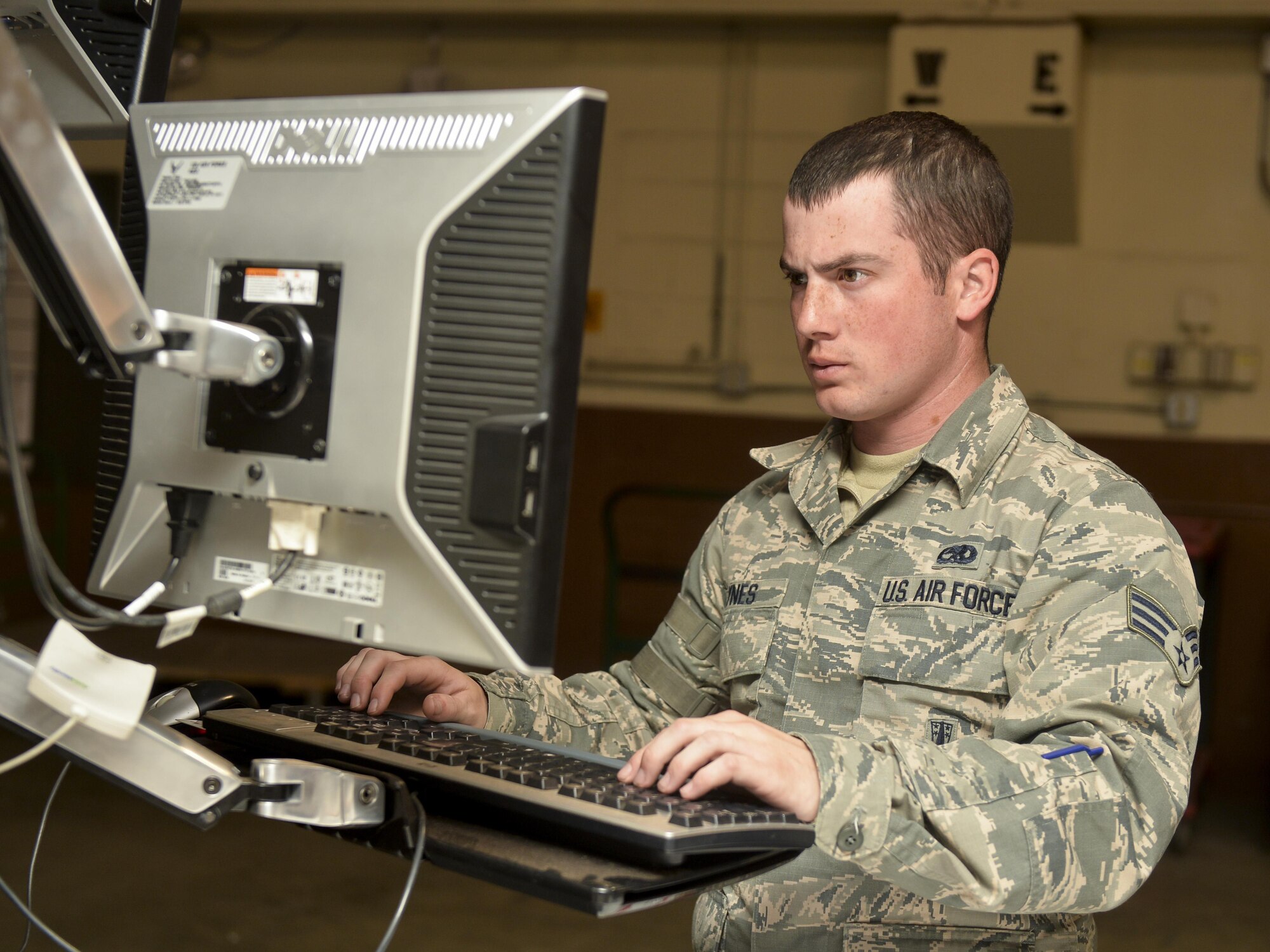 Senior Airman Christopher Haynes, 2nd Munitions Squadron munitions inspector, references a technical order at Barksdale Air Force Base, La., Feb. 23, 2016. Haynes used the instruction to certify all inspections steps were followed.  (U.S. Air Force photo/Airman 1st Class Mozer O. Da Cunha)