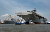 PASCAGOULA, Miss. (June 5, 2012) Tugboats guide the amphibious assault ship Pre-Commissioning Unit (PCU) America (LHA 6) to her berthing place at Ingalls Shipbuilding. America was christened Oct. 20, 2012 (U.S. Navy photo courtesy of Ingalls Shipbuilding/Released) 