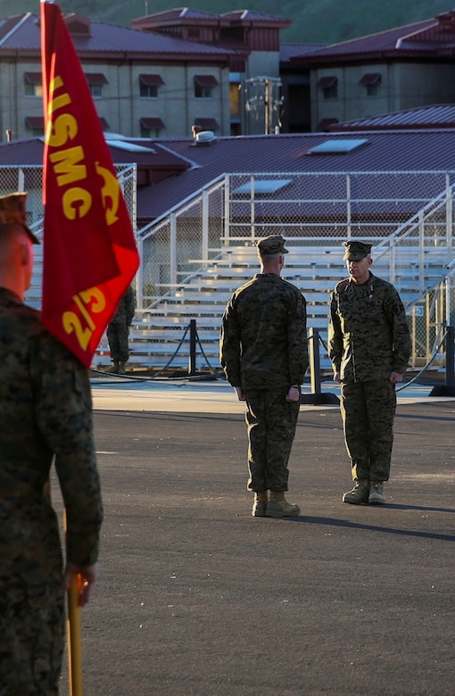 Sgt. Roberto J. Perez, center, stands at attention before receiving the Navy and Marine Corps Commendation Medal. The award was presented to Perez by Lt. Gen. David H. Berger for being selected as the I Marine Expeditionary Force noncommissioned officer of the year. The NCO of the year is awarded to a Marine who exemplifies the highest standards of the Marine Corps, both physically and mentally, and has the ability to inspire Marines. Perez is a squad leader with 2nd Battalion, 5th Marine Regiment, 1st Marine Division. Berger is the commanding general of I MEF. (U.S. Marine Corps photo by Pvt. Robert Bliss)