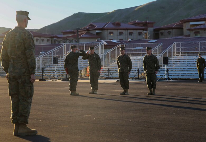 Sgt. Roberto J. Perez, left, salutes Lt. Gen. David H. Berger after receiving the Navy and Marine Corps Commendation Medal. The award was presented to Perez by Berger for being selected as the I Marine Expeditionary Force noncommissioned officer of the year. The NCO of the year is awarded to a Marine who exemplifies the highest standards of the Marine Corps, both physically and mentally, and has the ability to inspire Marines. Perez is a squad leader with 2nd Battalion, 5th Marine Regiment, 1st Marine Division. Berger is the commanding general of I MEF. (U.S. Marine Corps photo by Pvt. Robert Bliss)