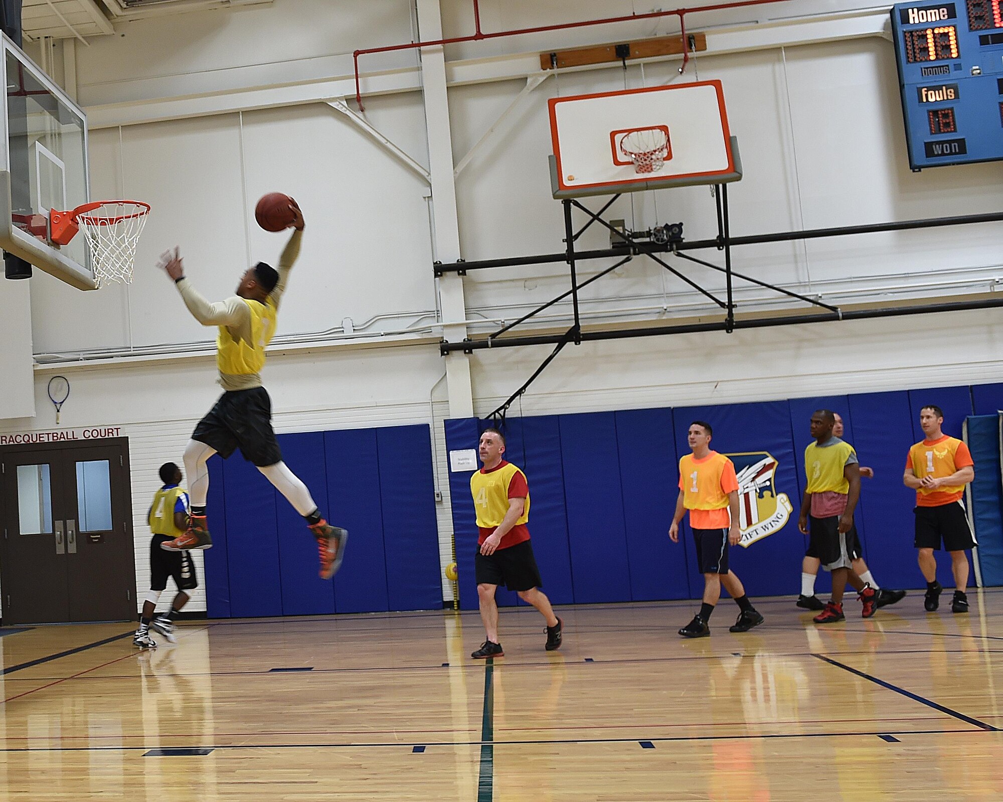 Senior Airman Kaymaun Alexander, a member of the 910th Security Forces Squadron (SFS),  goes up for a dunk during warm ups prior to an intramural  basketball game between SFS and the Navy and Marine Corps Reserve detachments. The game was part of the intramural basketball tournament hosted by the 910th Force Support Squadron. The tournament is open to all units based at Youngstown Air Reserve Station and is played annually during the winter months on Unit Training Assembly weekends. (U.S. Air Force Photo/ Tech. Sgt. Rick Lisum)