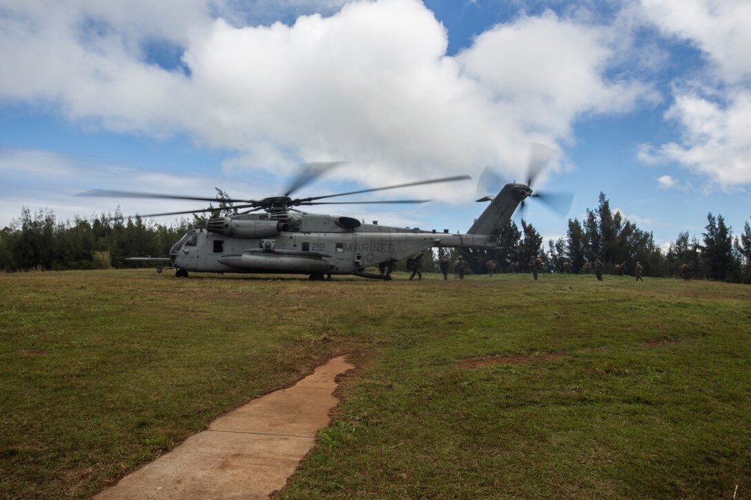 A U.S. Marine Corps CH-53E Super Stallion with the 13th Marine Expeditionary Unit drops off Marines at the Combined Arms Combat Training Facility, Oahu, Hawaii, Feb. 20, 2016. More than 4,500 Marines and Sailors with the 13th Marine Expeditionary Unit and Boxer Amphibious Ready Group are transiting the Pacific Ocean en route to the Pacific and Central Command areas of responsibility. (U.S. Marine Corps photo by Sgt. Tyler C. Gregory/released)