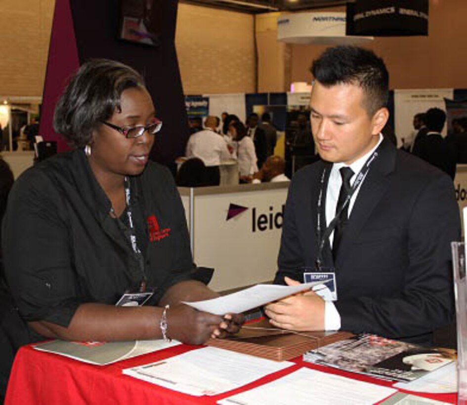 USACE Philadelphia District Engineer Christine Lewis-Coker spoke with a student during the Black Engineer of the Year Award Conference (BEYA) in Philadelphia Feb 18-20, 2016. USACE employees met with students and young professionals at the event career fair.