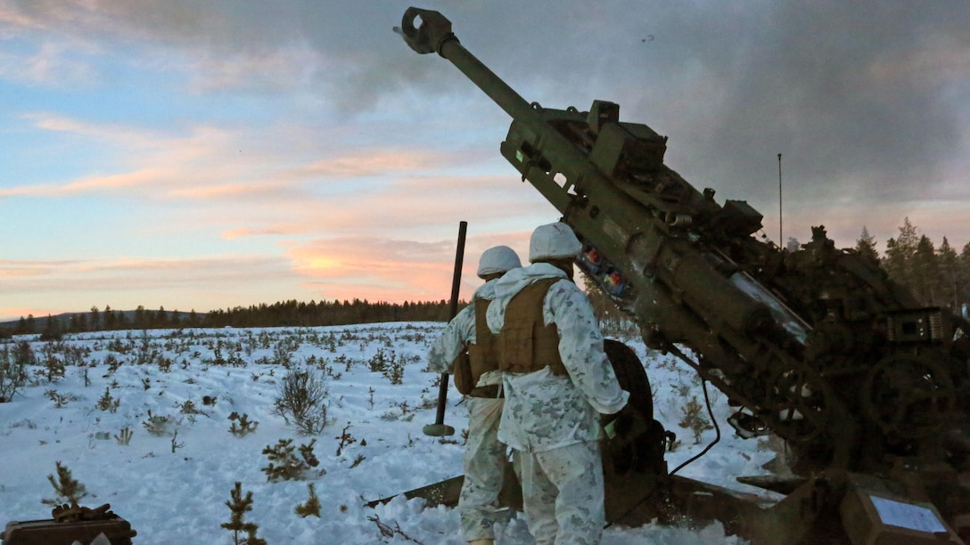 Marines with Combined Arms Company, step back as an M777 Howitzer fires a round during a live-fire shoot in Rena, Norway, Feb. 23, 2016, in preparation for Exercise Cold Response 16. The exercise will include 12 NATO allies and partner nations, and approximately 16,000 troops. The Marines will provide indirect fire support for infantry units during the exercise.