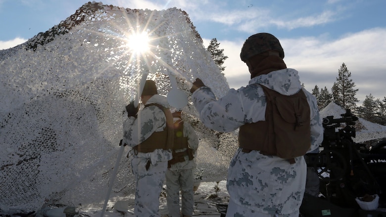 Marines with Combined Arms Company, camouflage their trucks before a live-fire shoot in Rena, Norway, Feb. 23, 2016, in preparation for Exercise Cold Response 16. The exercise will include 12 NATO allies and partner nations, and approximately 16,000 troops. The Marines will provide indirect-fire support for infantry units during the exercise.