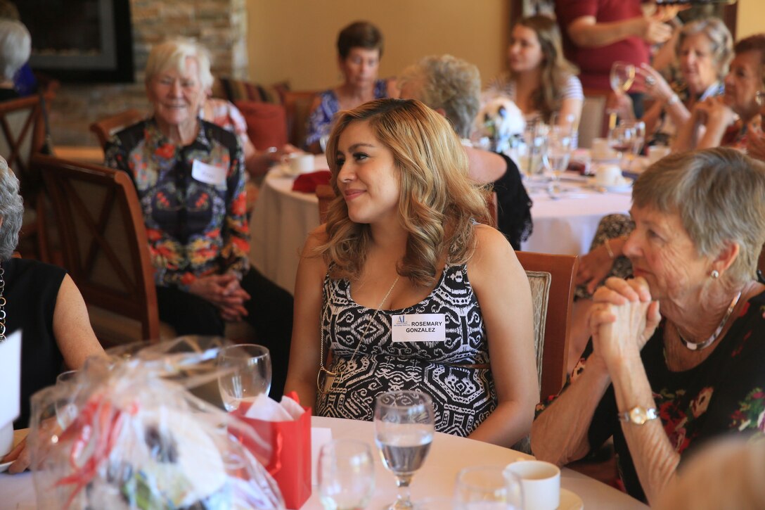 Rosemary Gonzalez, expectant mother, talks with the ladies of the Assistance League of Palm Springs Desert Area during the assistant league’s Baby Shower Luncheon for Combat Center expectant mothers at the Oasis Country Club in Palm Desert, Calif., Feb. 16, 2016. (Official Marine Corps Photo by Cpl. Julio McGraw/Released)